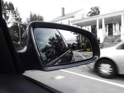 Car side mirror of moving car